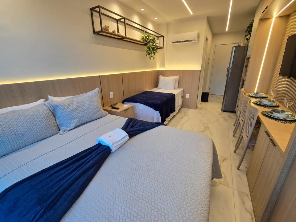 Bed, TV and multimedia, Kitchen or kitchenette, Living room, Photo of the whole room, Seating area, Bedroom, oven, air conditioner