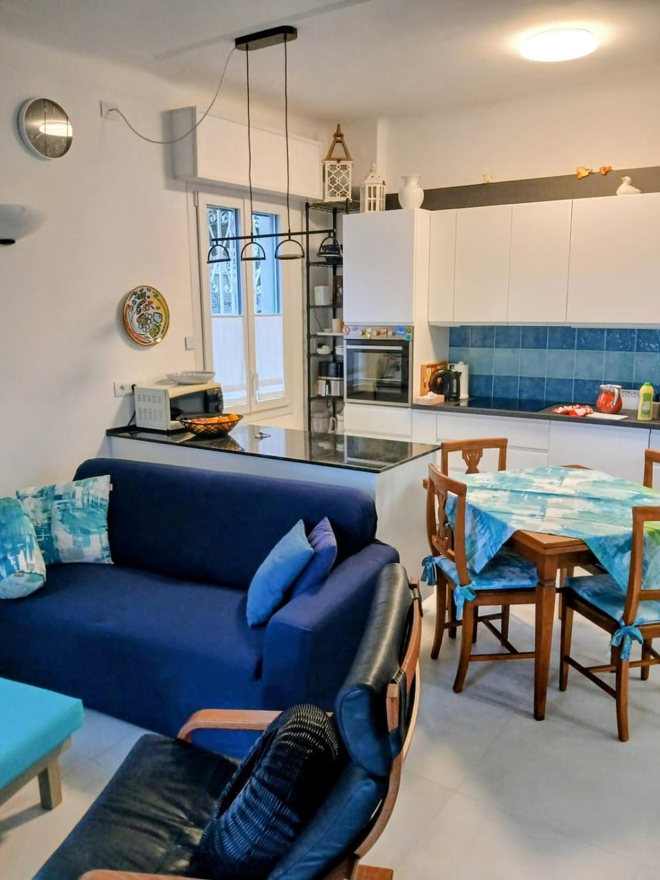 Living room, Seating area, Dining area, dishwasher, microwave, oven, stove, kitchen, air conditioner