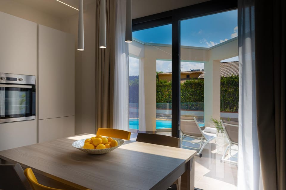 Kitchen or kitchenette, Dining area, Pool view