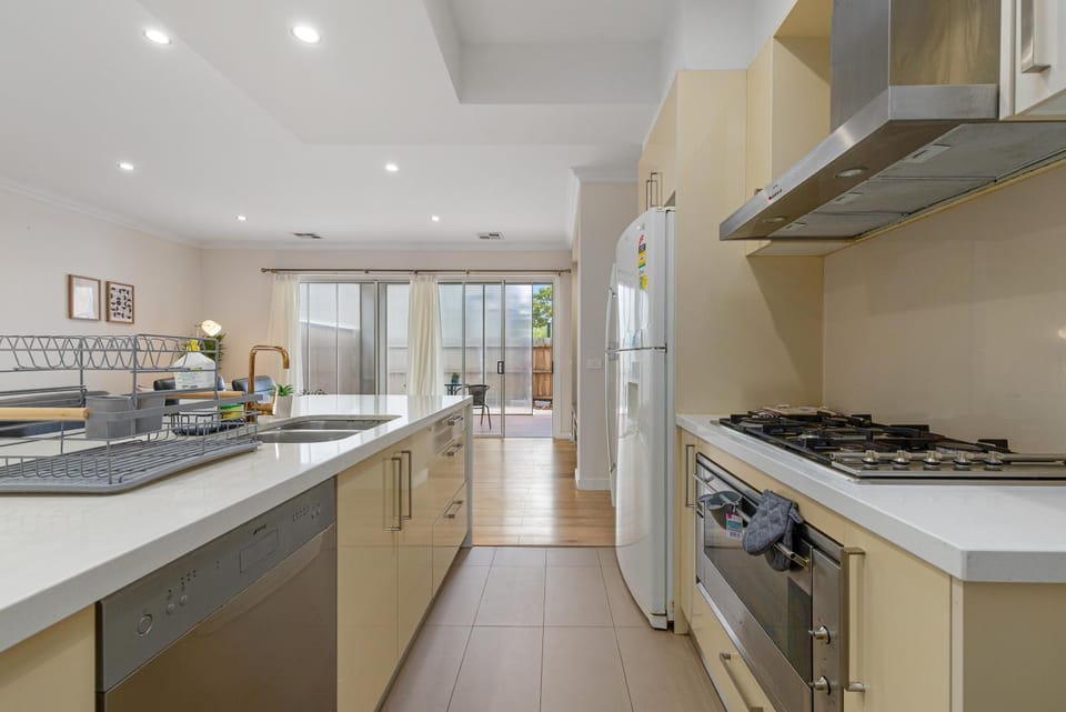 Kitchen or kitchenette, dishwasher, oven, stove