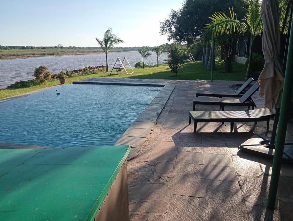 River Frontage Chalets along Zambezi River - Enjoy Game & Canoeing Safaris as well as Boat Cruises & Fishing - Starlink Internet & Backup available Apartment in Zimbabwe