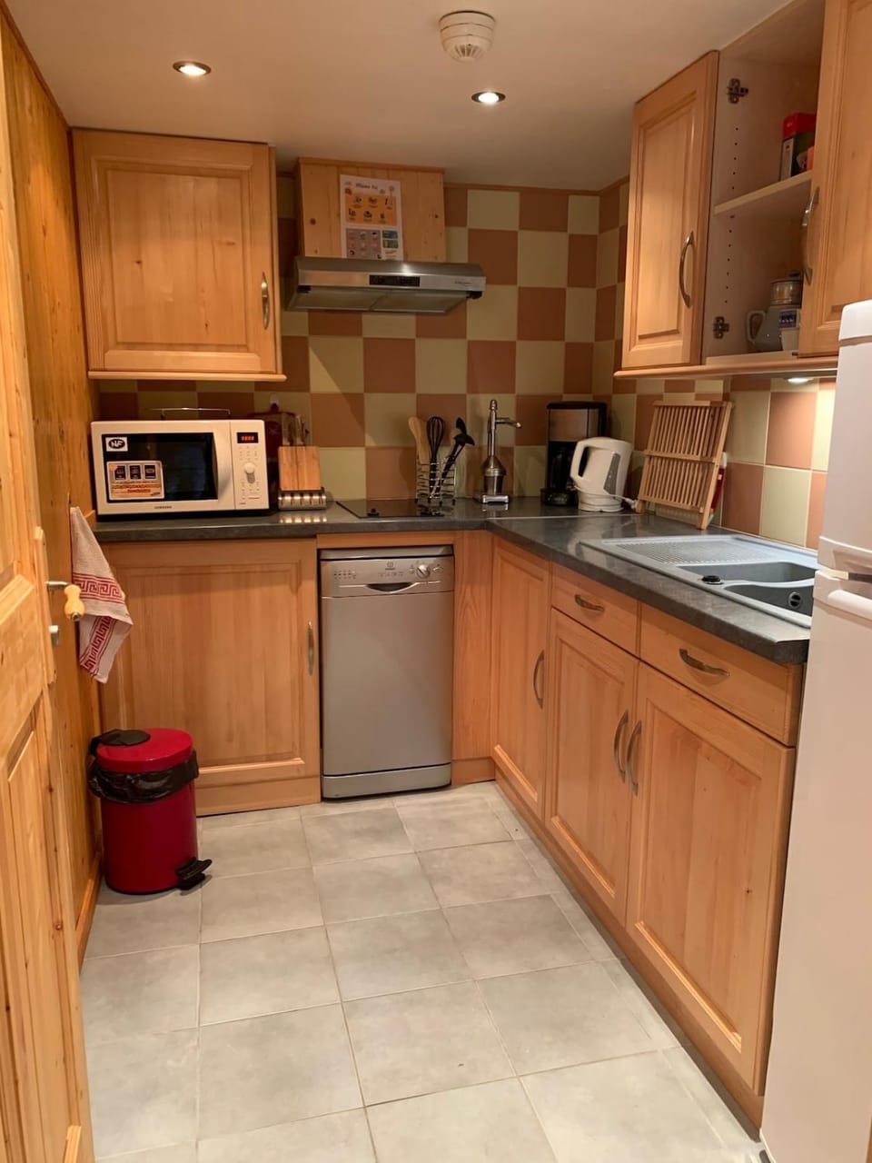 Kitchen or kitchenette, dishwasher, oven, stove, toaster, washing machine