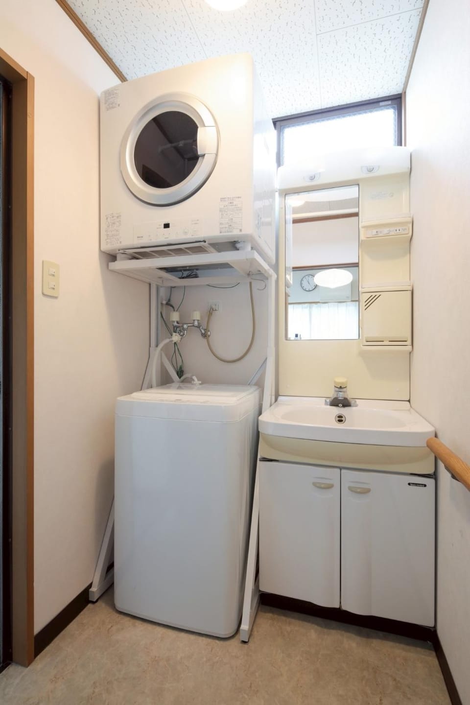 flat iron, hair dryier, towels, laundry, washing machine, dryer