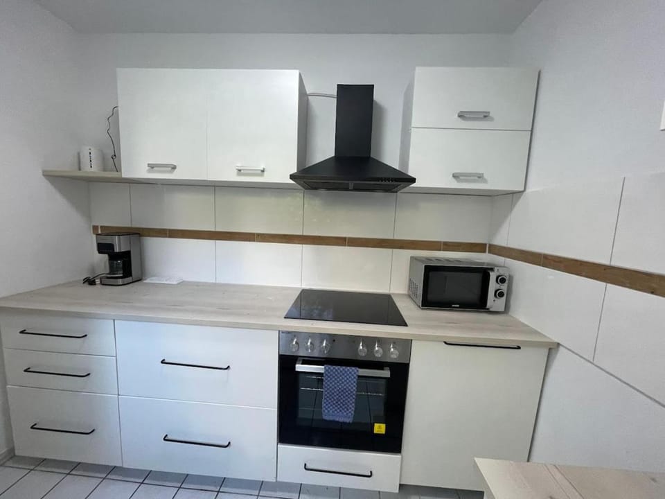 Kitchen or kitchenette, oven, stove