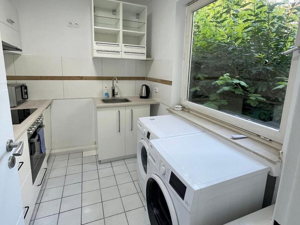 Kitchen or kitchenette, dishwasher, oven, stove, washing machine, dryer