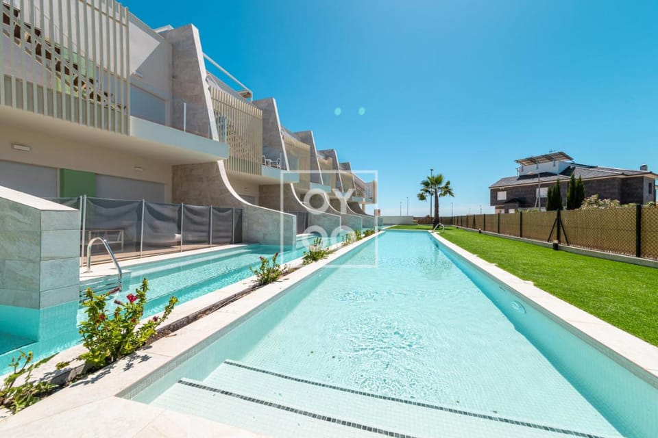 Pilar Poolside Living, luxury swim-up apt, ground-floor - by Oyoostays Apartment in Pilar de la Horadada