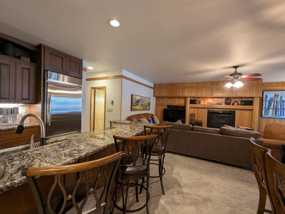 Kitchen or kitchenette, Living room, Seating area, Dining area, fireplace, furniture