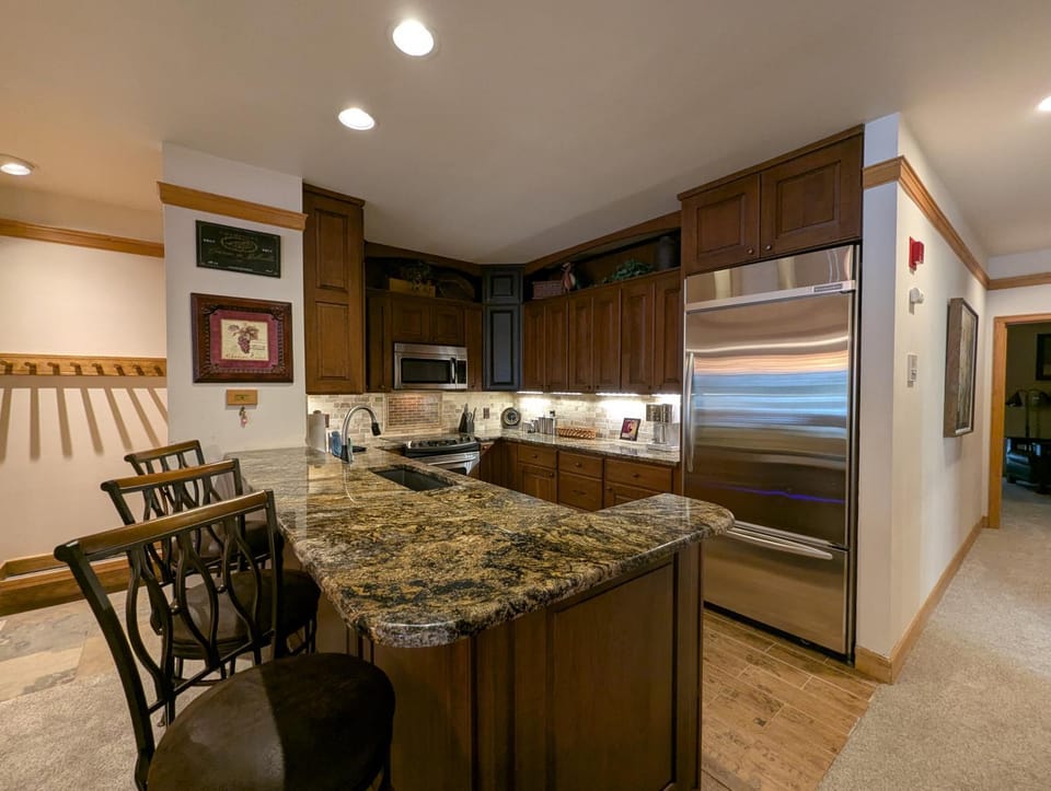 Kitchen or kitchenette, Seating area, Dining area, furniture, microwave, oven, stove, toaster, kitchen