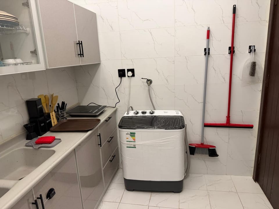 Kitchen or kitchenette, washing machine