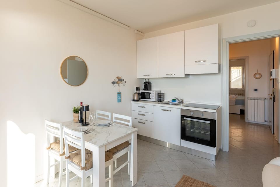 Kitchen or kitchenette, microwave, oven, stove, stove