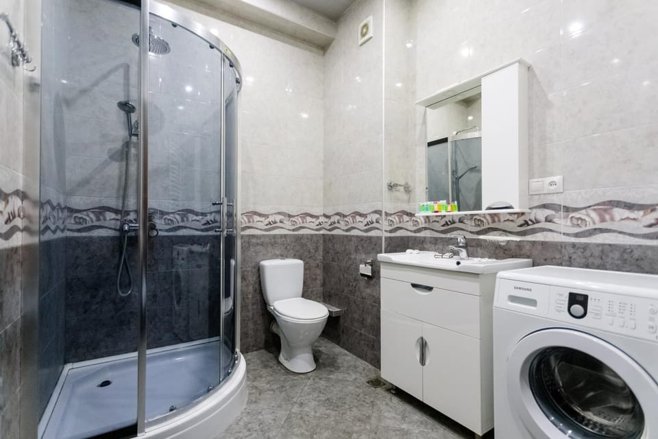 Shower, Toilet, Bathroom, towels, washing machine, dryer