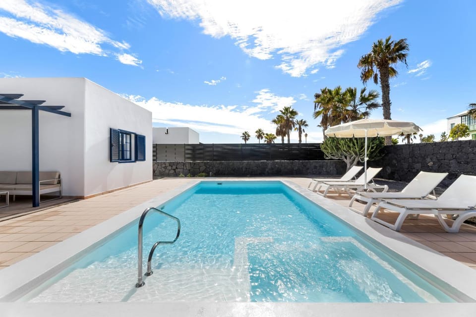 Patio, Day, Natural landscape, Pool view, Swimming pool, sunbed