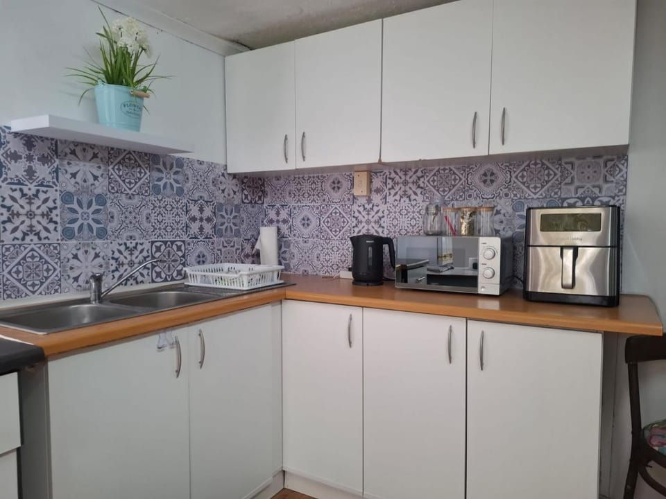 Kitchen or kitchenette, microwave, stove, toaster