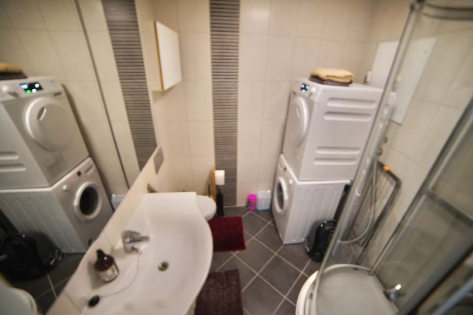 Shower, Toilet, Bathroom, towels, washing machine, dryer