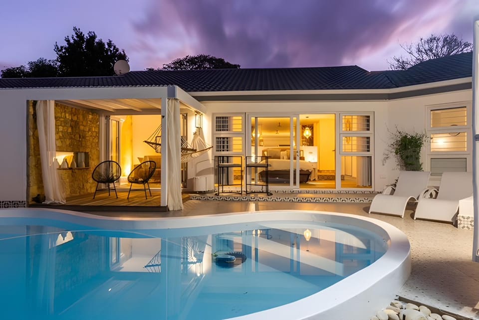 Property building, Patio, Living room, Swimming pool, sunbed