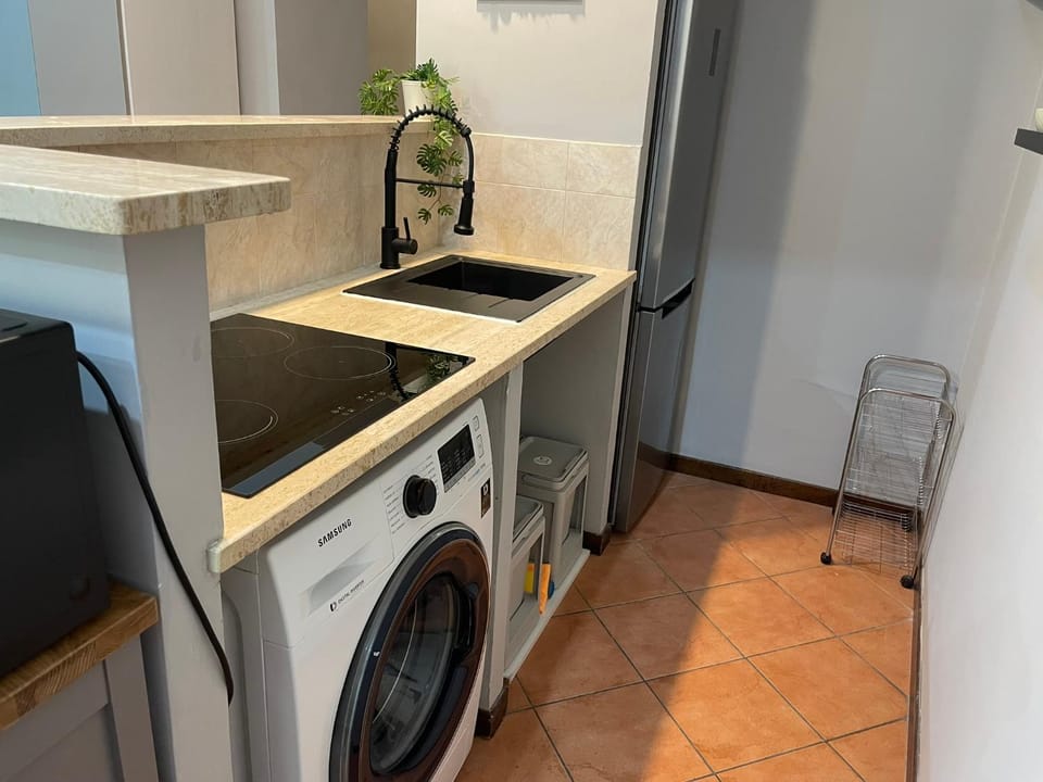 Kitchen or kitchenette, washing machine