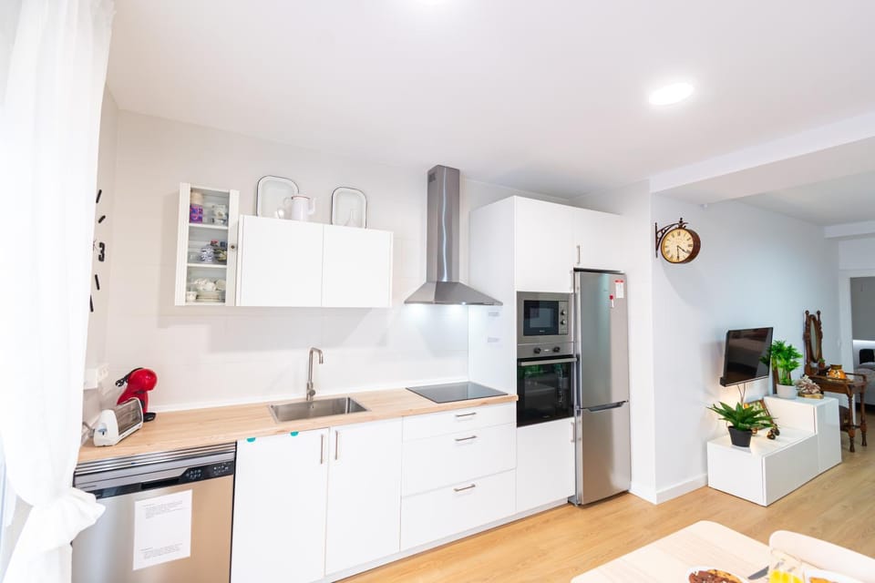 Kitchen or kitchenette, dishwasher, oven, stove