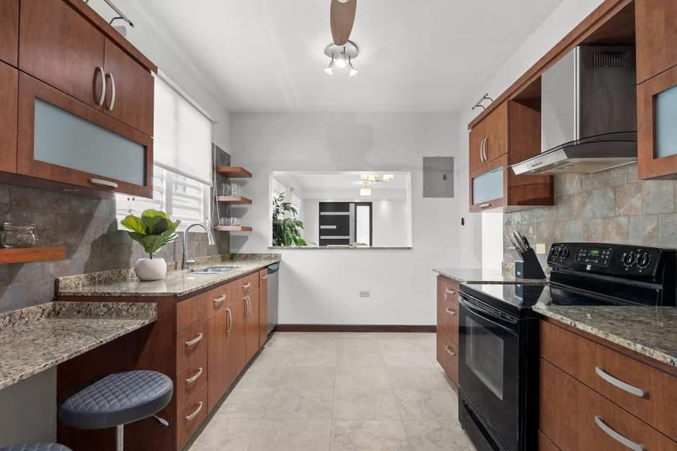 Kitchen or kitchenette, dishwasher, oven, stove