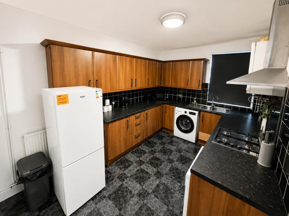 Kitchen or kitchenette, dishwasher, microwave, oven, stove, toaster, kitchen