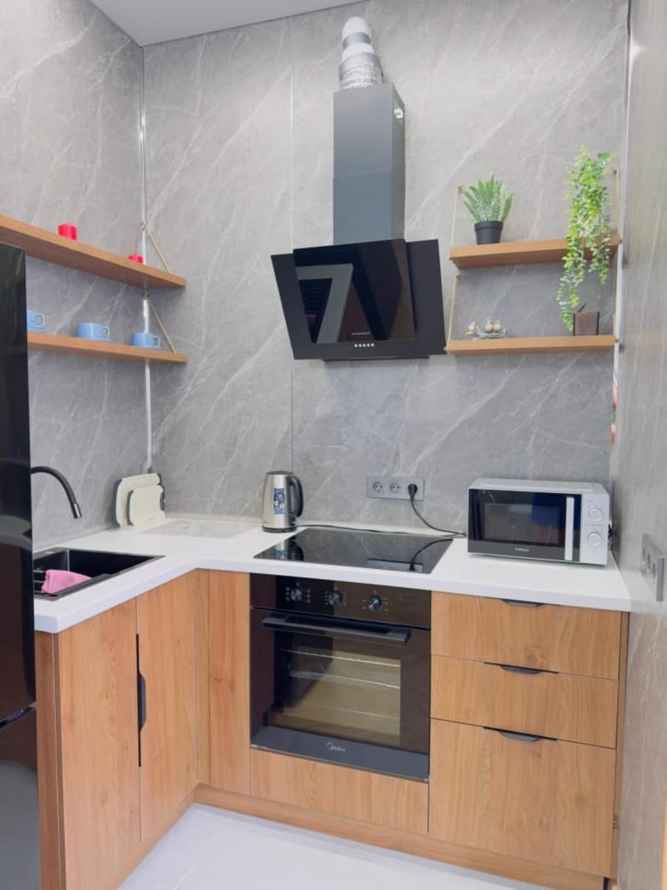 Kitchen or kitchenette, microwave, oven, stove