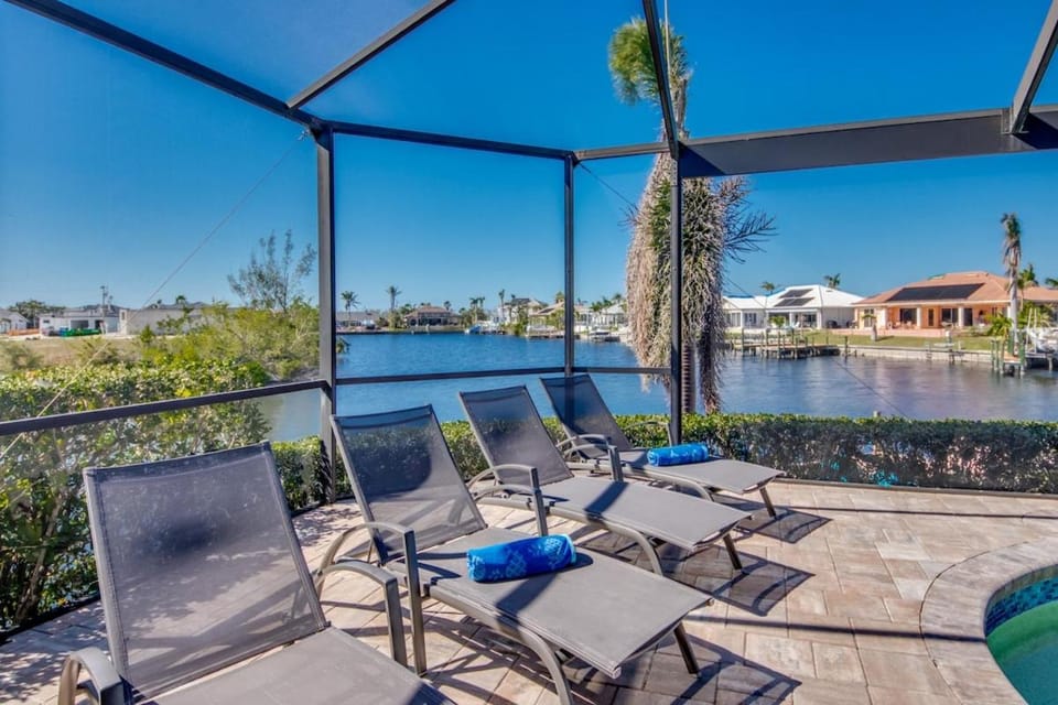 CoralVilla Sunset Cove - ping pong table, kayaks, pool, view, on water, boating House in Cape Coral
