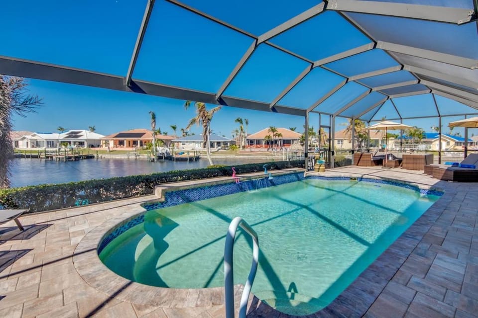 CoralVilla Sunset Cove - ping pong table, kayaks, pool, view, on water, boating House in Cape Coral
