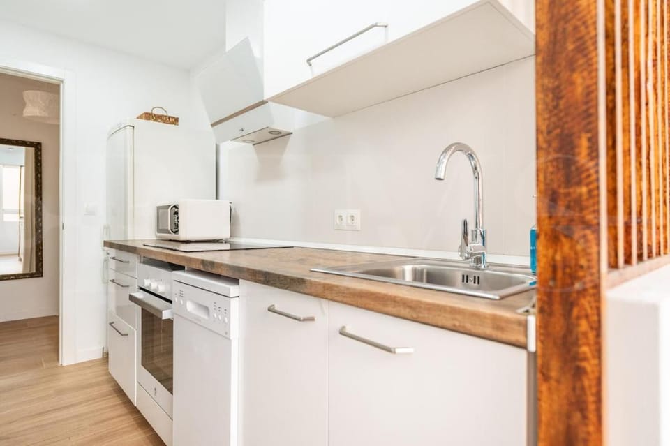 Kitchen or kitchenette, dishwasher, oven, stove