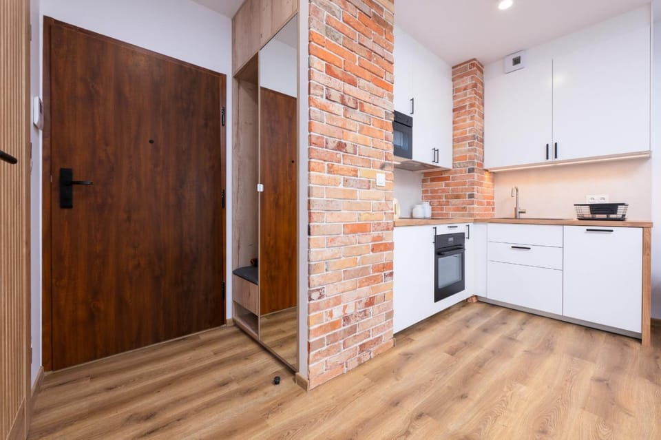Kitchen or kitchenette, dishwasher, oven, stove
