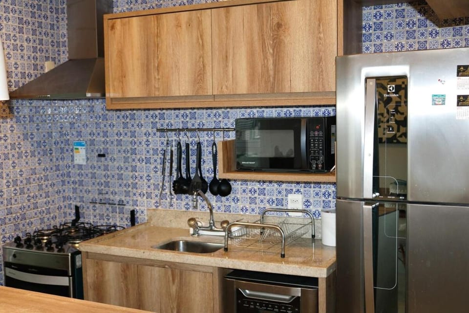 Kitchen or kitchenette, dishwasher, microwave, minibar, oven, stove, toaster