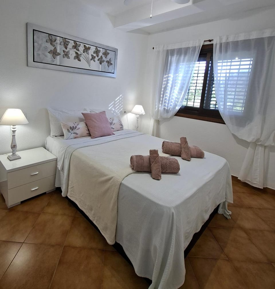 Bed, towels, wardrobe