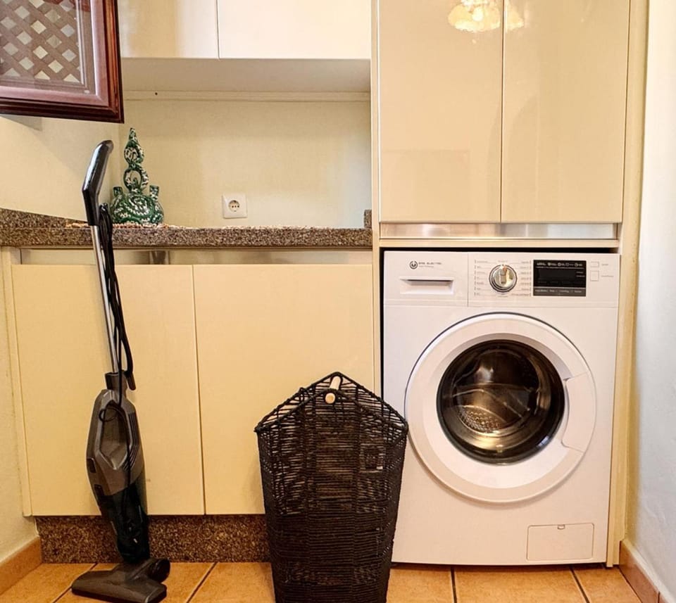 Kitchen or kitchenette, washing machine