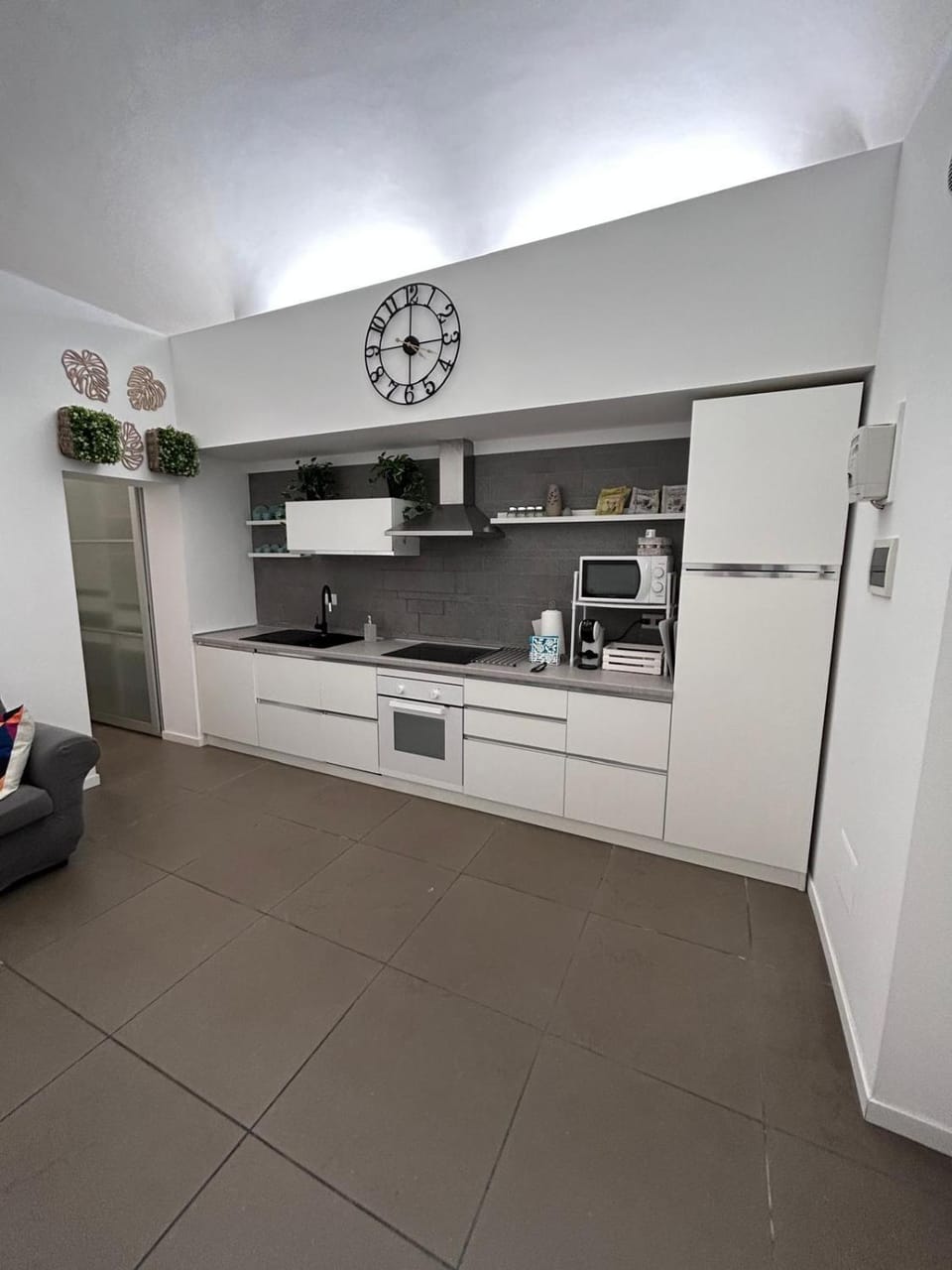 Kitchen or kitchenette, dishwasher, oven, stove