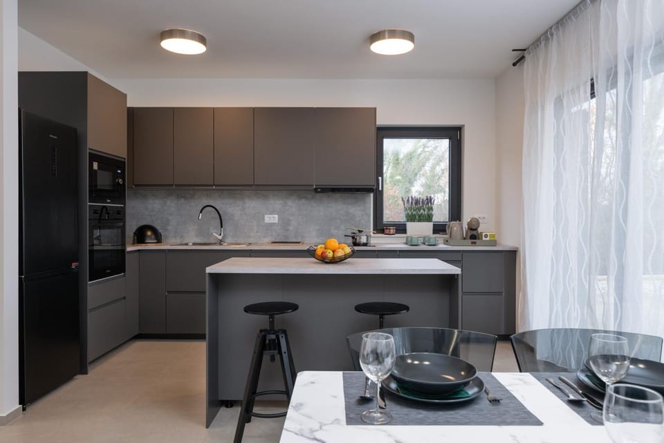 Kitchen or kitchenette, dishwasher, oven, stove