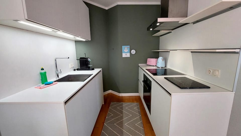Kitchen or kitchenette, dishwasher, oven, stove