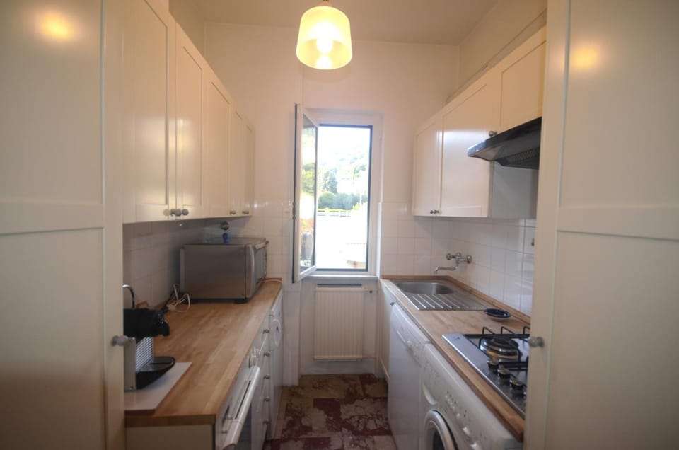 Kitchen or kitchenette, dishwasher, oven, stove