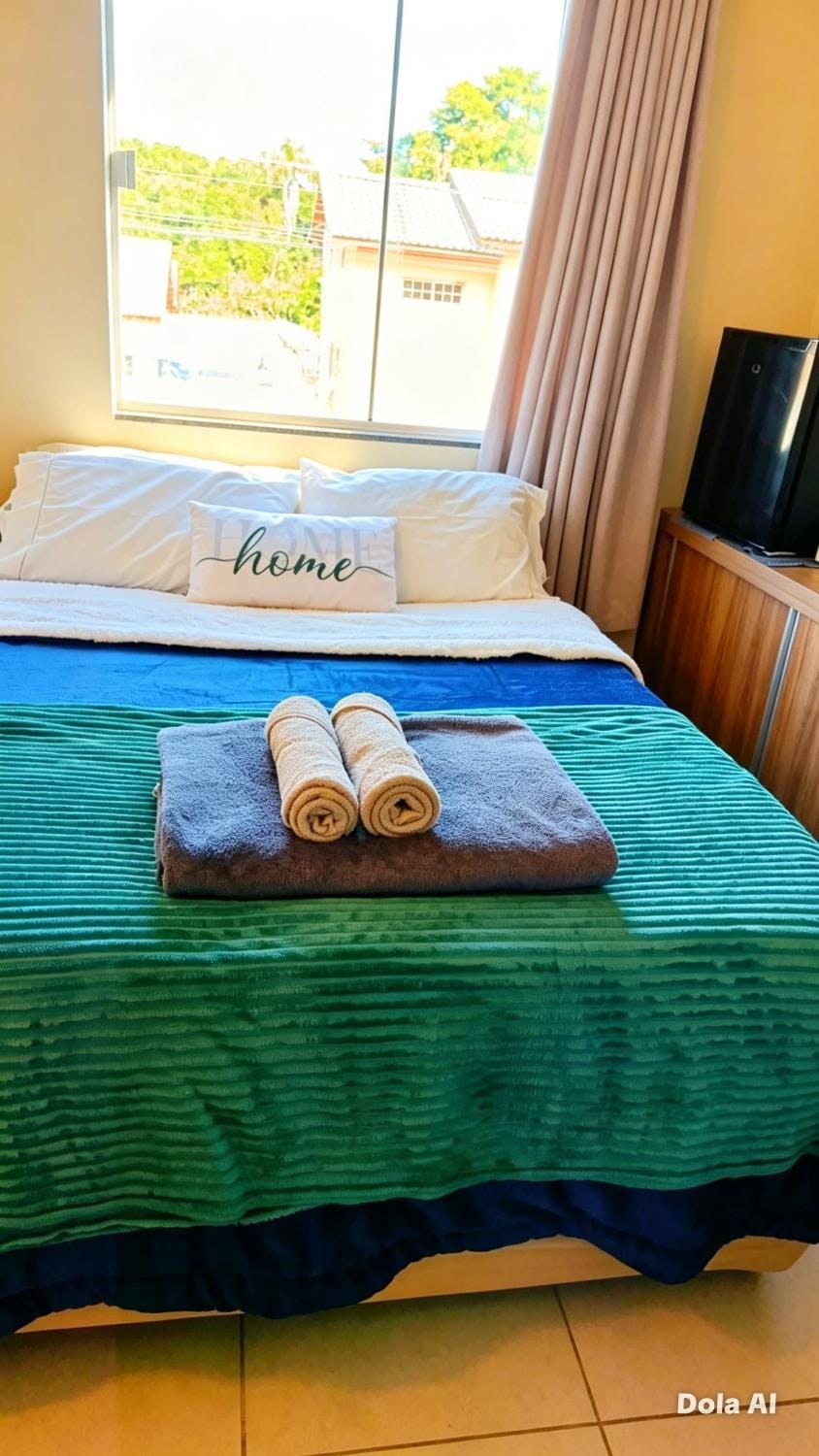 Quarto confortável em residência Familiar - WiFi - Netflix -Frigobar próx ao Aeroporto Apartment in Navegantes