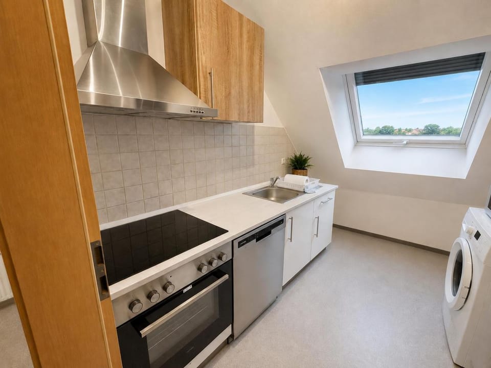 Kitchen or kitchenette, dishwasher, stove, washing machine