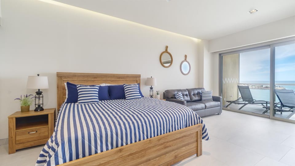 Bed, Seating area, Bedroom, Sea view