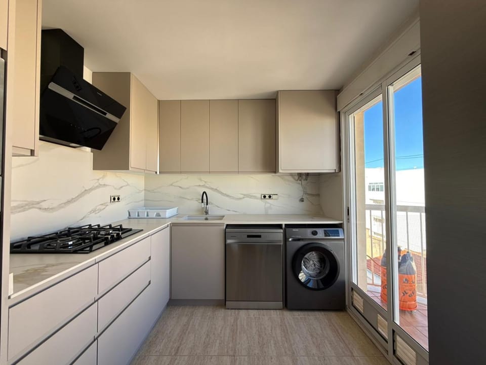 Kitchen or kitchenette, dishwasher, stove, washing machine