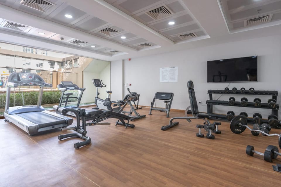 Free housekeeping visits during your stay - StayShort - Spacious JVC Apartment with Large Balcony Sleeps 4 Apartment in Dubai