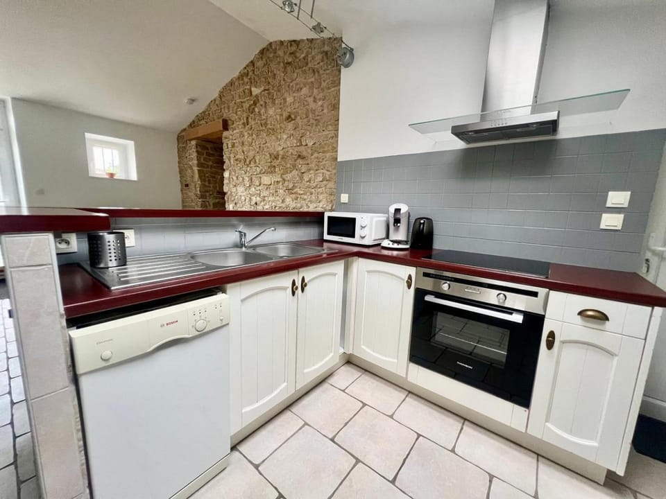 Kitchen or kitchenette, dishwasher, oven, stove, toaster