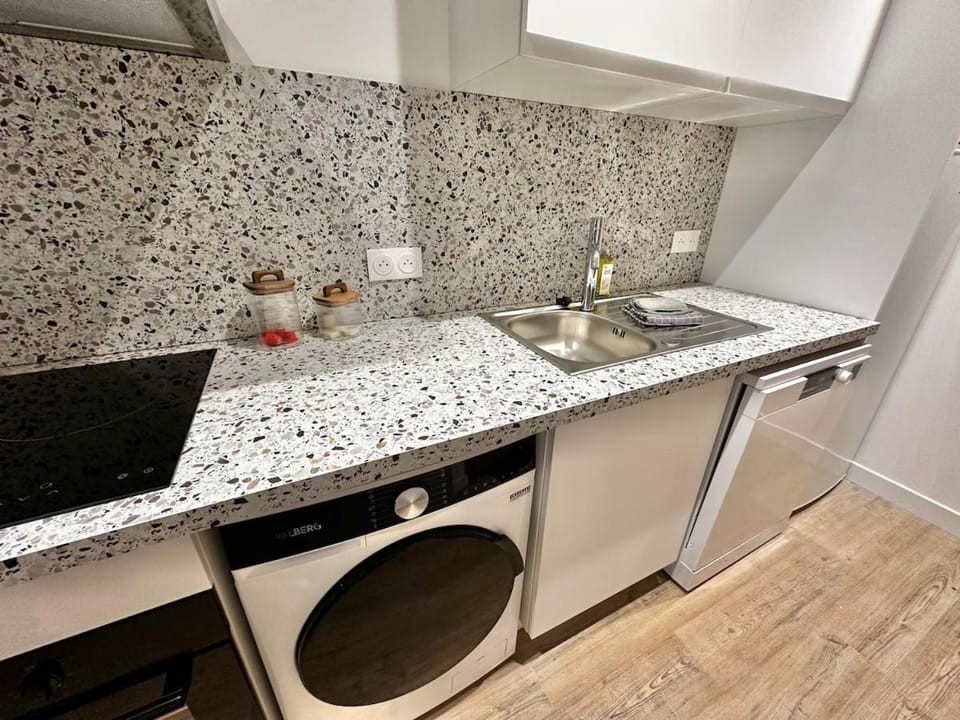 Kitchen or kitchenette, dishwasher, oven, stove, washing machine