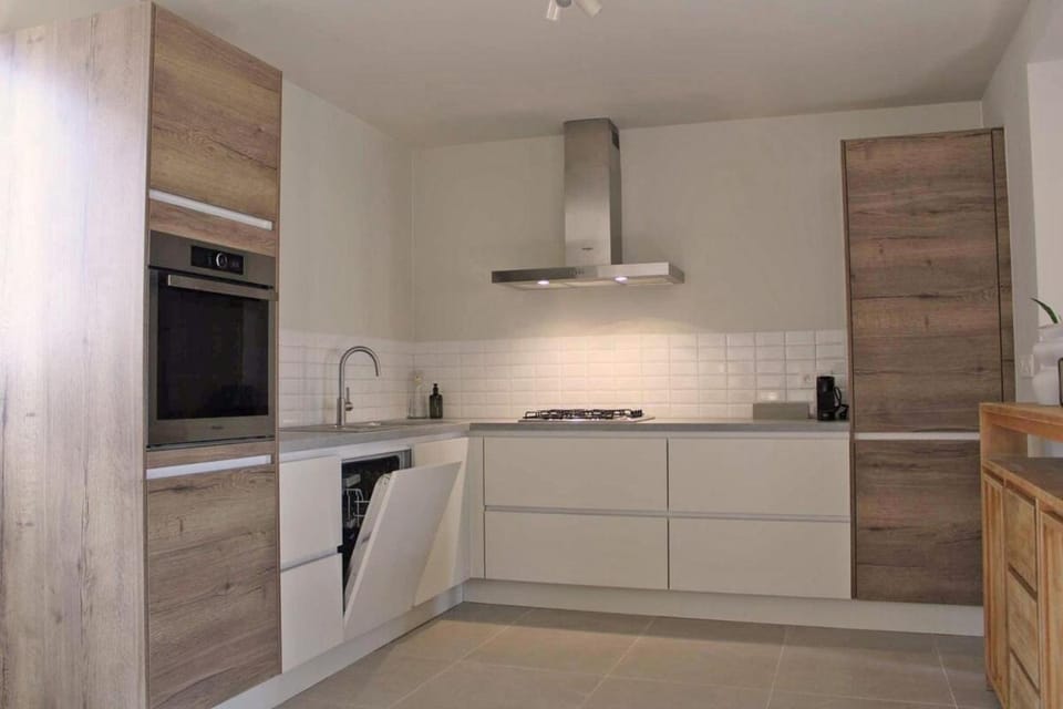 Kitchen or kitchenette, dishwasher, oven, stove