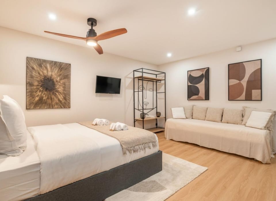 Bed, TV and multimedia, Living room, Seating area, wardrobe