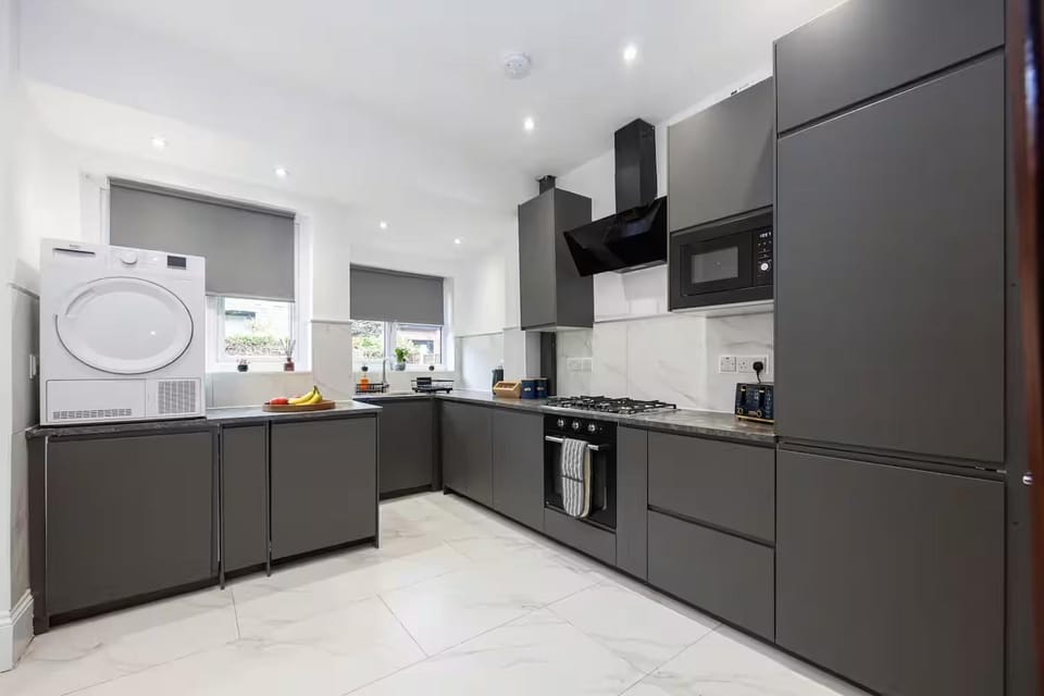 Kitchen or kitchenette, dishwasher, stove, washing machine, dryer