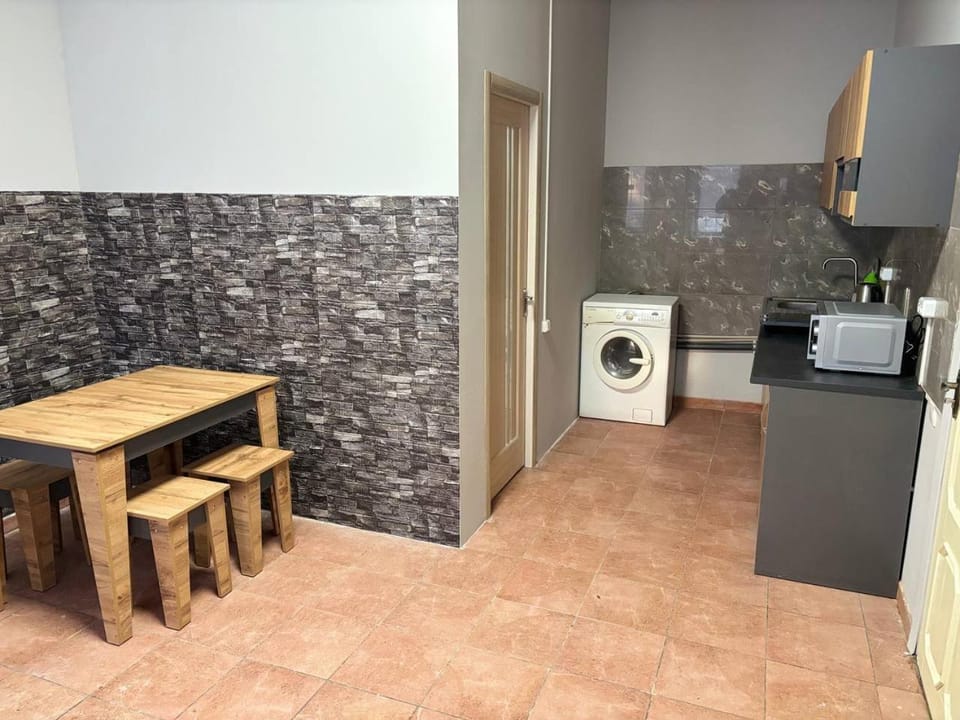 Kitchen or kitchenette, stove, washing machine