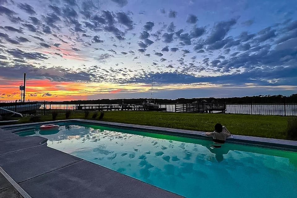Custom home on the Intracoastal with water views, pool, dock, & decks House in Holden Beach