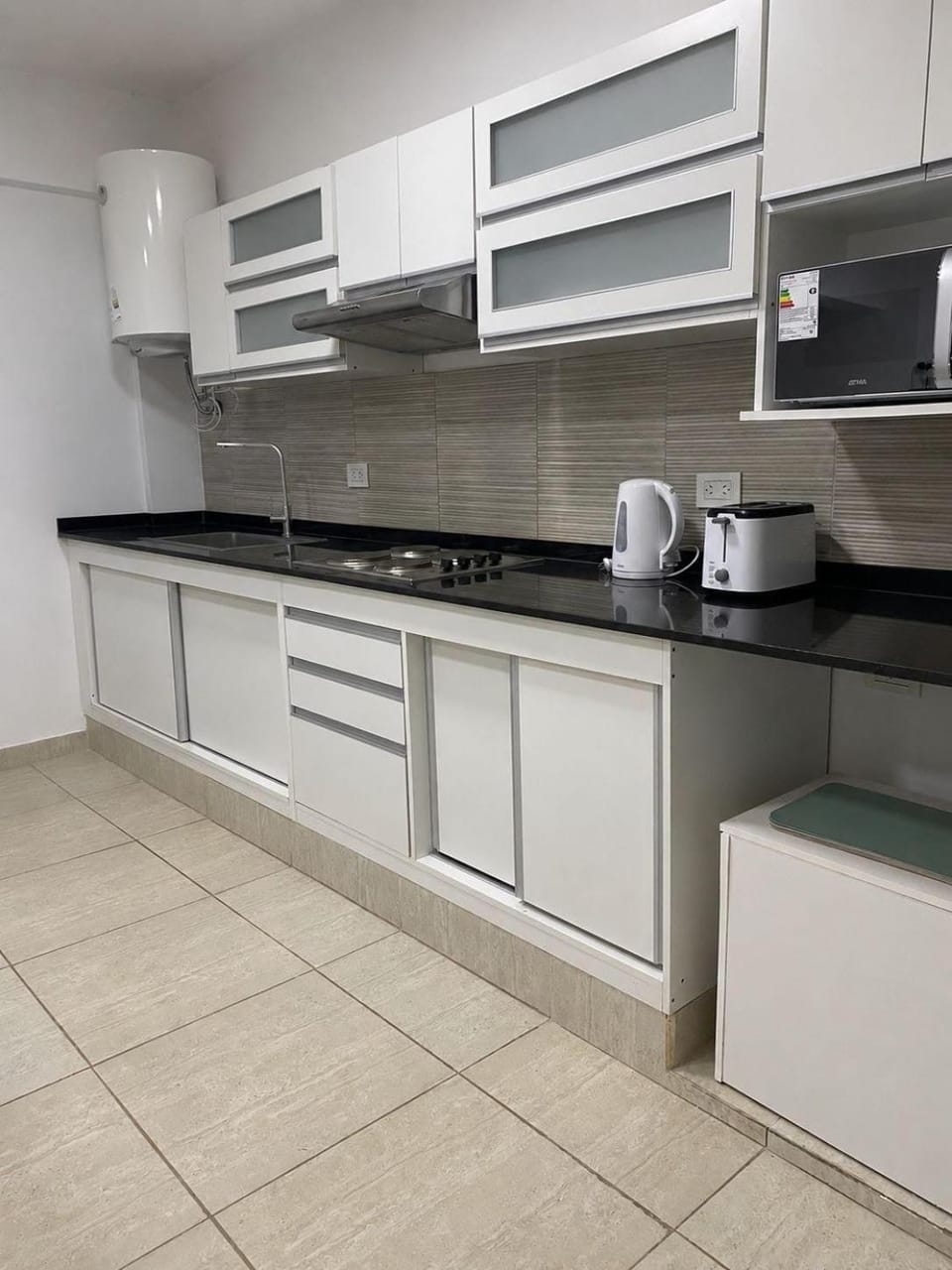 Kitchen or kitchenette, stove, toaster