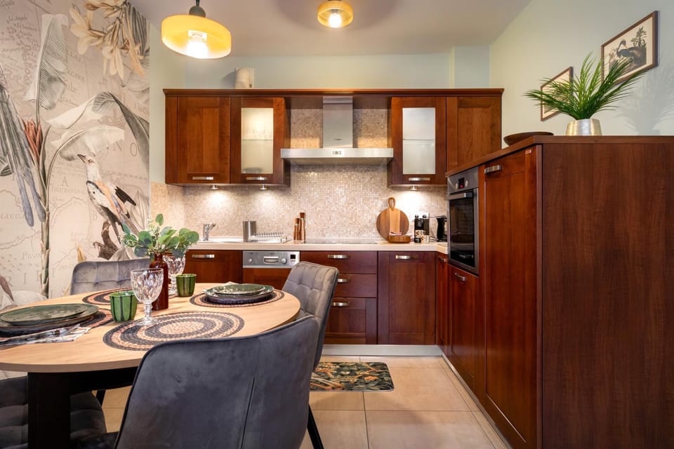 Kitchen or kitchenette, dishwasher, oven, stove