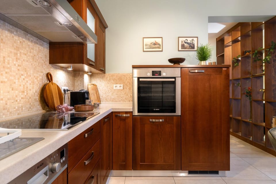 Kitchen or kitchenette, dishwasher, oven, stove